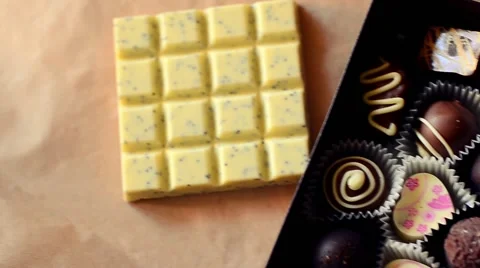 Natural Dark and White Chocolates in Brown Box with Postcard Stock Footage 59086684