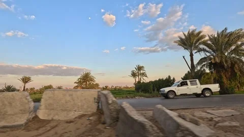 Natural desert landscapes appear while driving along Cairo Fayoum Desert Road Stock Footage 330089210