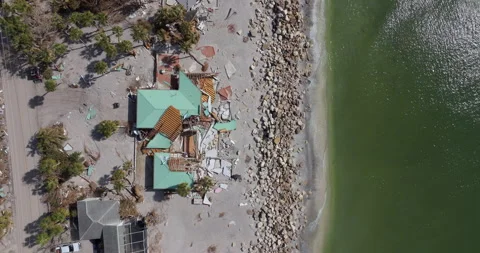 Natural disaster and its consequences. Hurricane destroyed house roof and walls Stockbeeldmateriaal 300416871