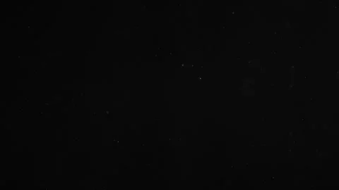 Natural Dust Particles Float On Black Background. Dust In Motion. Stock Footage 247322728