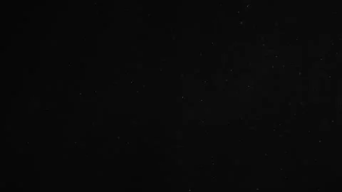 Natural Dust Particles Float On Black Background. Dust In Motion. Stock Footage 247322961