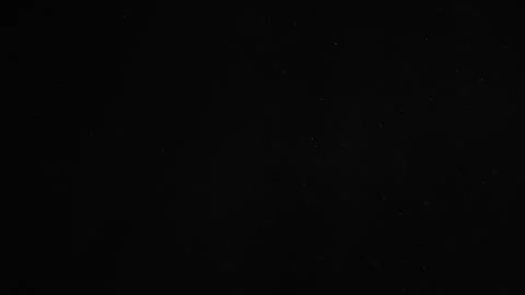 Natural Dust Particles Float On Black Background. Dust In Motion. Stock Footage 247323209
