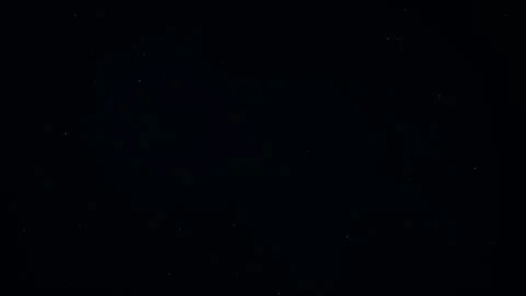 Natural Dust Particles Float On Black Background. Dust In Motion. Stock Footage 247581377