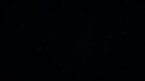 Natural Dust Particles Float On Black Background. Dust In Motion. Stock Footage 247582017