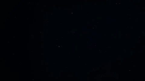 Natural Dust Particles Float On Black Background. Dust In Motion. Stock Footage 247582232