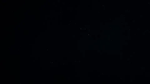 Natural Dust Particles Float On Black Background. Dust In Motion. Stock Footage 247585336