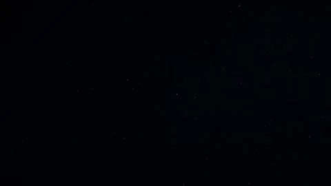 Natural Dust Particles Float On Black Background. Dust In Motion. Stock Footage 247585399