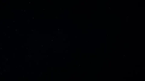 Natural Dust Particles Float On Black Background. Dust In Motion. Stock Footage 247585421