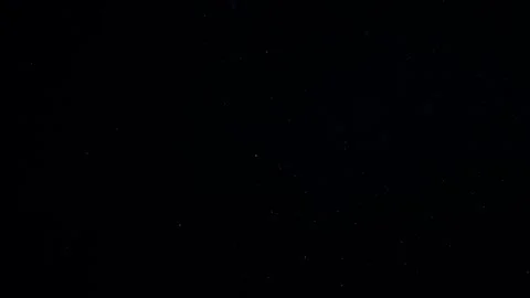 Natural Dust Particles Float On Black Background. Dust In Motion. Stock Footage 247585742