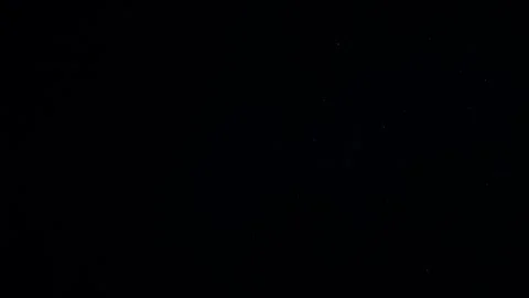 Natural Dust Particles Float On Black Background. Dust In Motion. Stock Footage 247585848