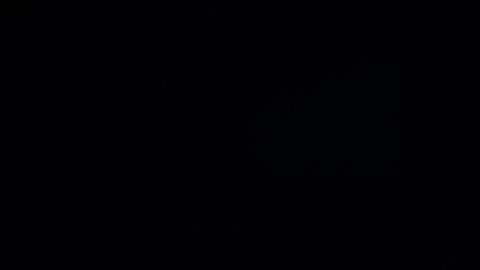 Natural Dust Particles Float On Black Background. Dust In Motion. Stock Footage 247585915