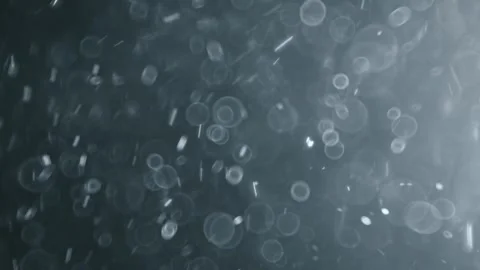 Natural dust particles floating in light beam on dark background creating c.. Stock Footage 337352023