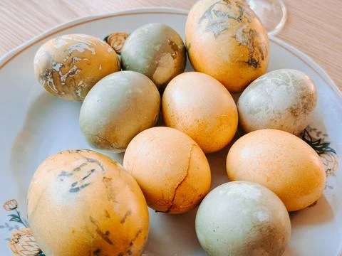 Natural Dyed Easter Eggs on Plate with Organic Patterns Photos