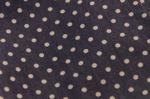 Natural fabric texture with pattern, white circles on dark blue 库存照片