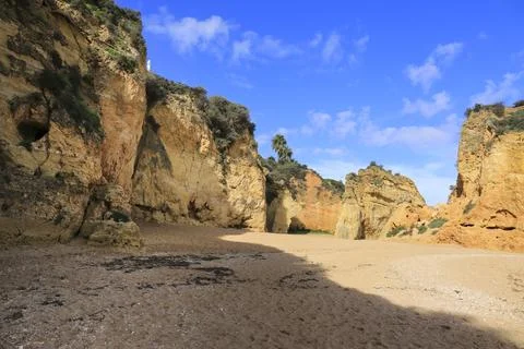 Natural features, cliffs and limestone formations in Praia da Batata Beach Stock Photos