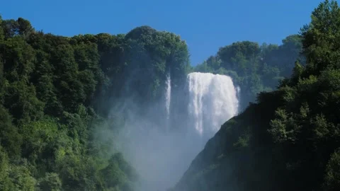 Natural forest landscape with a large waterfall, trees and blue sky in Italy. Video stock 157614981