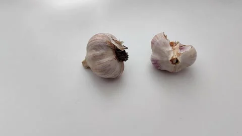 Natural Garlic Bulbs, One Split to Reveal Cloves Stock Footage 321118396