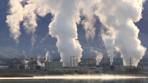 Natural gas power plant blowing smoke into the air Stock Footage