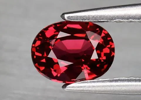 Natural gem red ruby on gray background Stock Photos