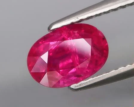 Natural gemstone red ruby on a gray background 写真素材