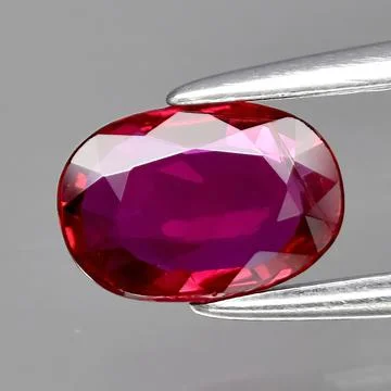 Natural gemstone red ruby on gray background 写真素材