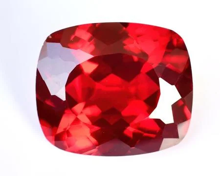 Natural gemstone red ruby on gray background Stock Photos