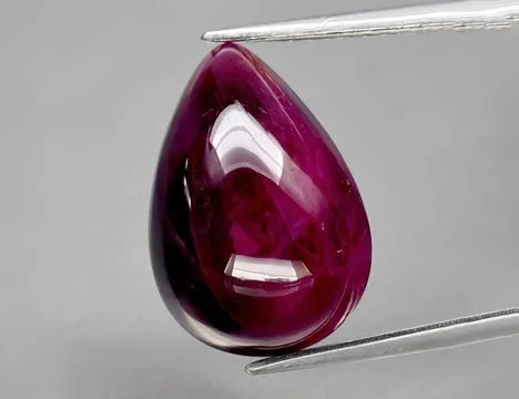 Natural gemstone red ruby on gray background 写真素材