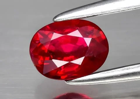 Natural gemstone red ruby on gray background Stock Photos