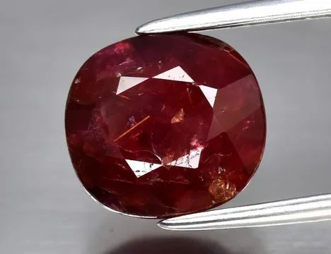 Natural gemstone red ruby on gray background Stock Photos