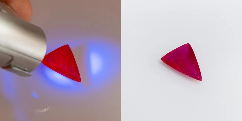 Natural gemstone red ruby on a white background and under ultraviolet Stock Photos