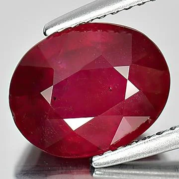 Natural gemstone red ruby on white background Stock Photos