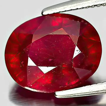 Natural gemstone red ruby on white background Stock Photos