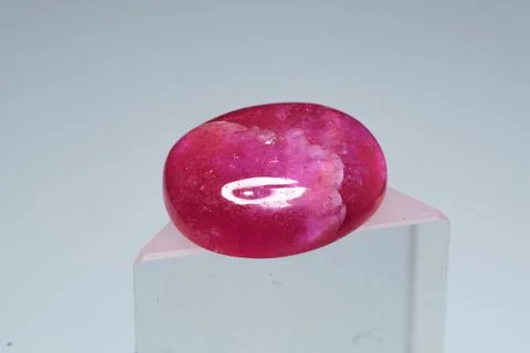 Natural gemstone ruby on a stand white background 库存照片