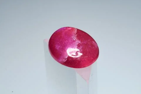 Natural gemstone ruby on a stand white background Stock Photos