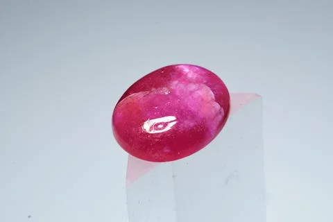 Natural gemstone ruby on a stand white background 库存照片