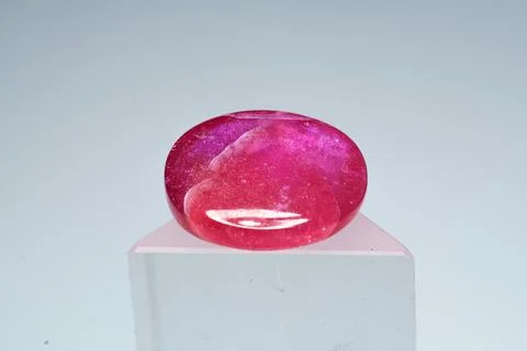 Natural gemstone ruby on a stand white background 스톡 사진