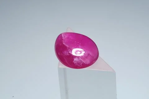 Natural gemstone ruby on a stand white background Stock Photos