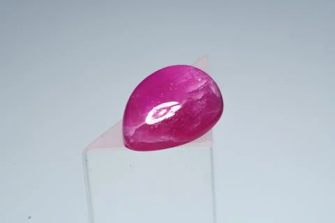 Natural gemstone ruby on a stand white background Stock Photos