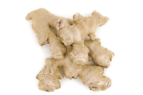 Natural ginger captured on smooth white background. Stock Photos