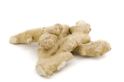 Natural ginger placed on clean white surface. Stock Photos