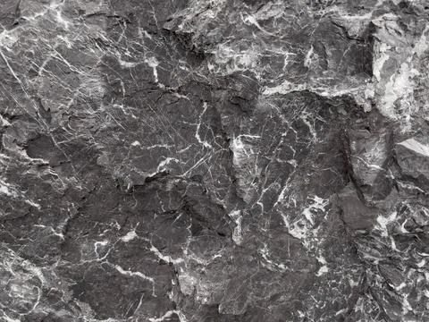 Natural gray stone background. Structure with white veins Stock Photos