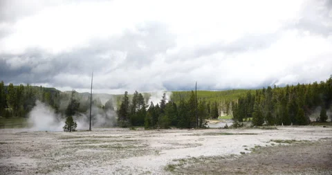 Natural hot spring surrounded by mountains and wilderness Stock-Footage 341423044