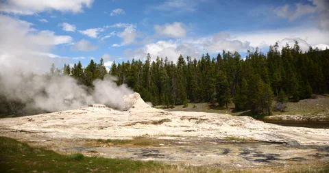 Natural hot spring surrounded by mountains and wilderness Stock Footage 341435440