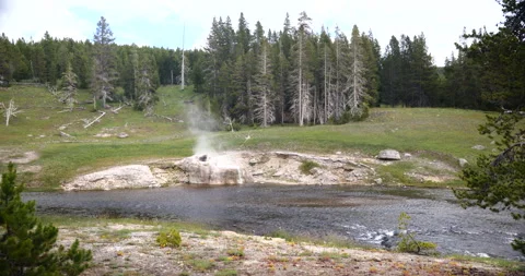 Natural hot spring surrounded by mountains and wilderness Stock Footage 341442829
