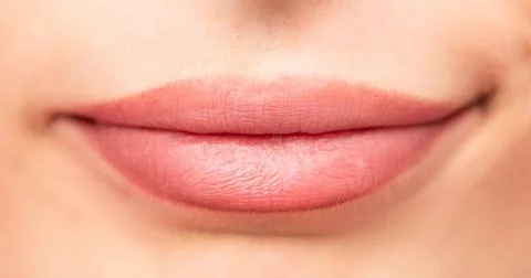 Natural human lips, slightly parted with soft pink hue Stock Photos
