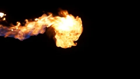 Natural jet of flame from right of frame against black Video stock 77134431