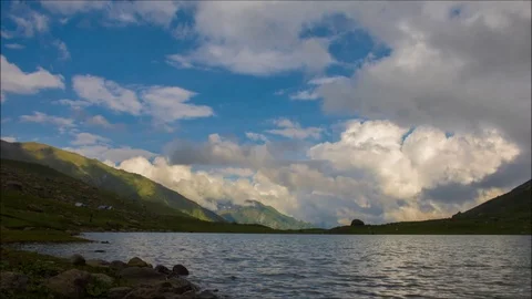 Natural lake with floating clouds over it in kashmir Stock Footage 104072340