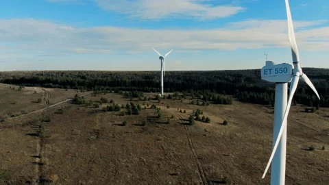 Natural landscape with several functioning wind energy turbines. Green energy Video stock 98488903
