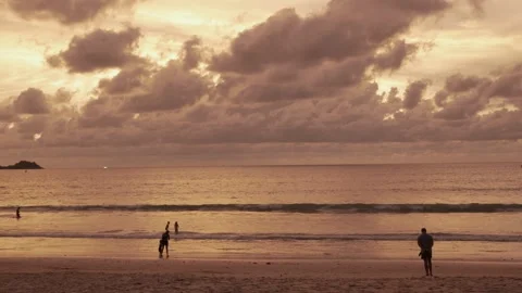 Natural landscape silhouette dramatic sunset over the sea beach surface in .. Stock Footage 276353350
