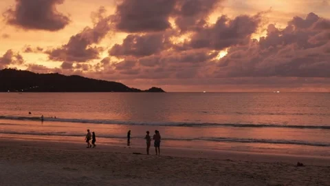Natural landscape silhouette dramatic sunset over the sea beach surface in .. Stock Footage 286348890